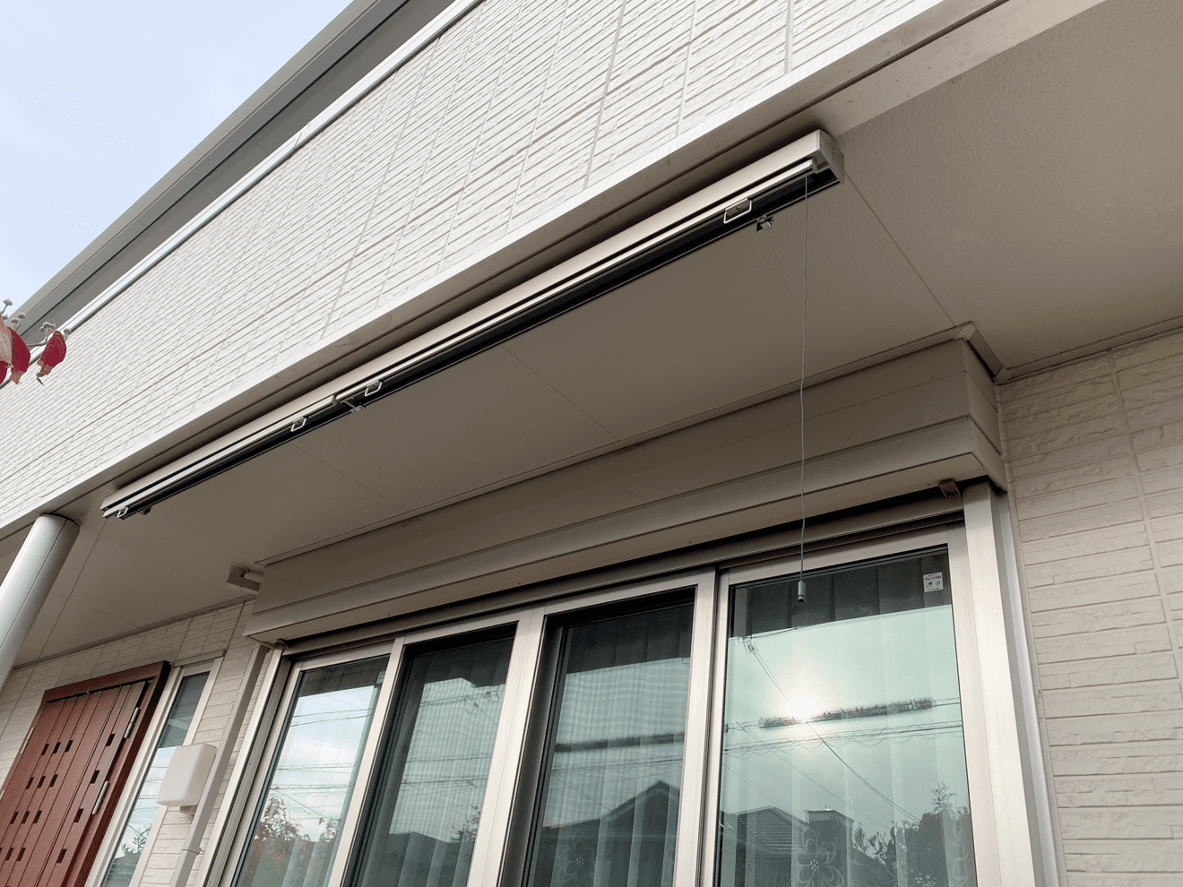 写真：ウッドデッキ上部に施行されたシェード - 福田造園の施工事例（愛知県みよし市）